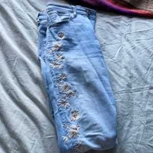 skinny jeans with flower print on side